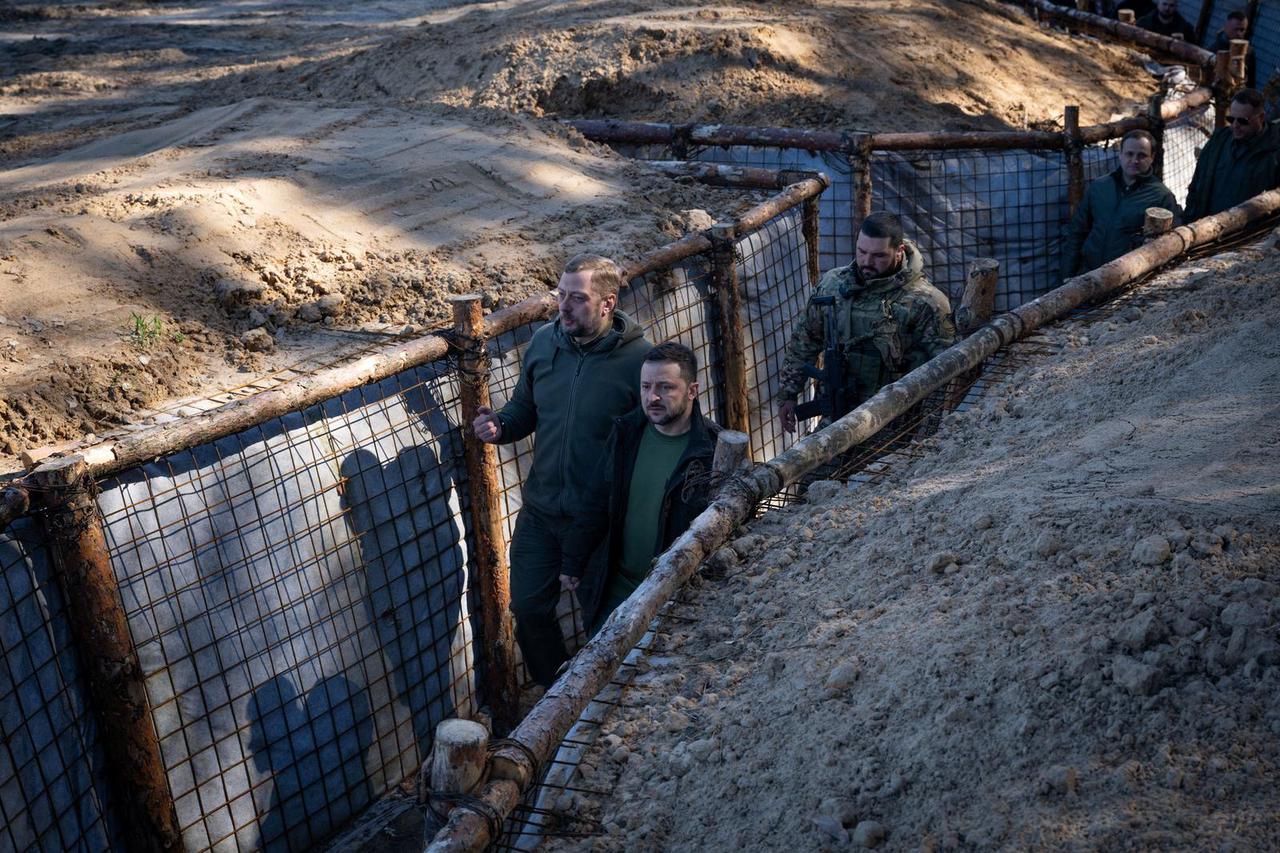Ukrainian servicemen build pontoon bridges during an exercise in Chernihiv region