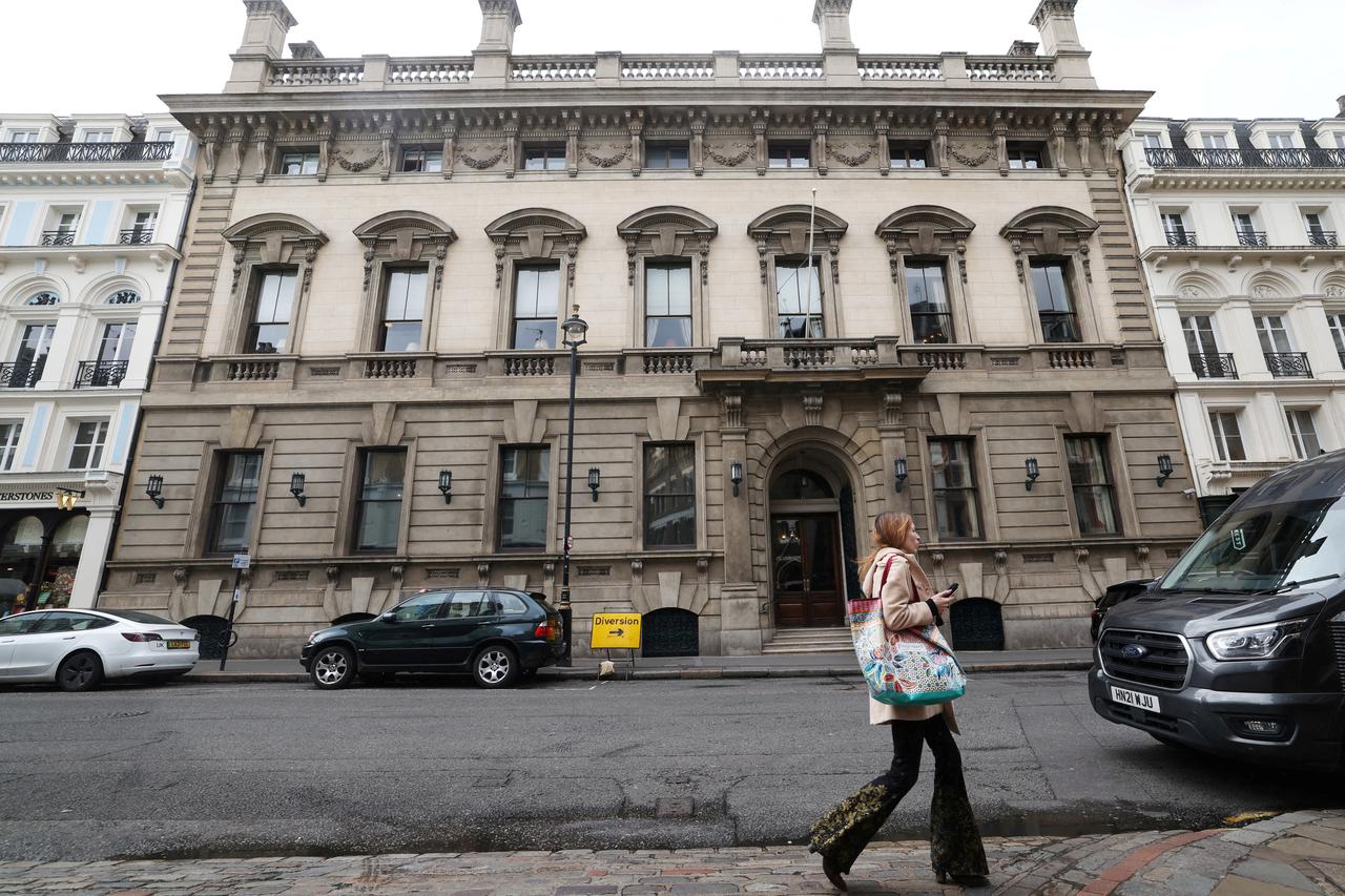 FILE PHOTO: A person walks past the entrance to the Garrick Club in London