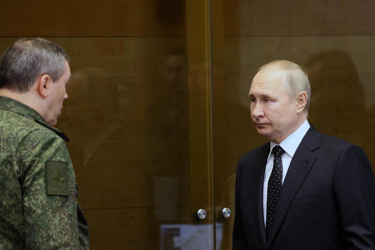 Russian President Vladimir Putin visits the Joint Headquarters of the Russian armed forces, in an unknown location