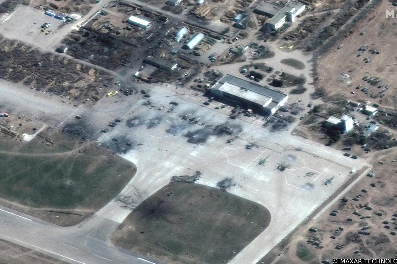 A satellite image shows destroyed Russian helicopters on a tarmac, at Kherson airfield