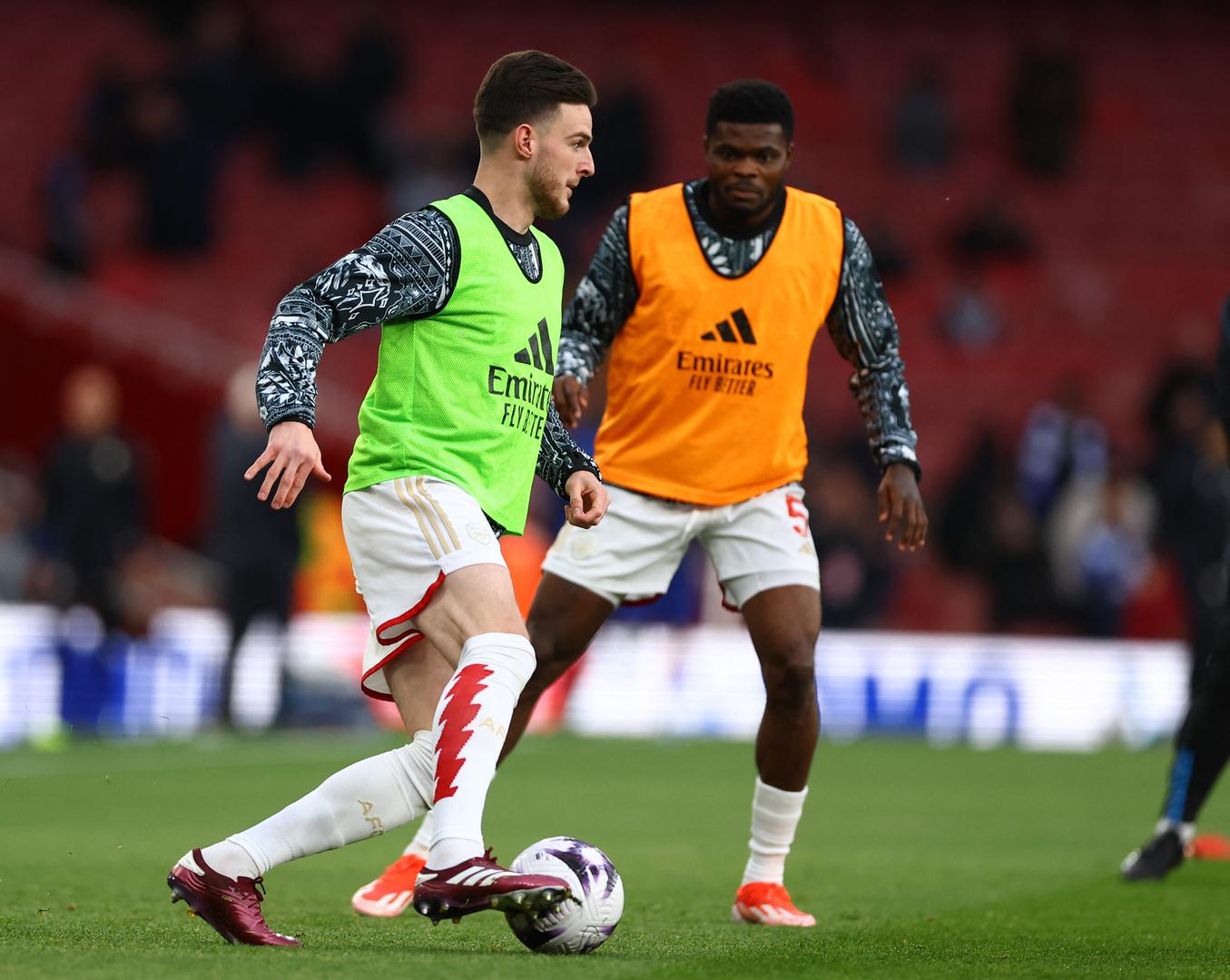 Soccer Football - Premier League - Arsenal v Chelsea - Emirates Stadium, London, Britain - April 23, 2024 Arsenal's Declan Rice and Thomas Partey during the warm up before the match Action Images via Reuters/Matthew Childs NO USE WITH UNAUTHORIZED AUDIO, VIDEO, DATA, FIXTURE LISTS, CLUB/LEAGUE LOGOS OR 'LIVE' SERVICES. ONLINE IN-MATCH USE LIMITED TO 45 IMAGES, NO VIDEO EMULATION. NO USE IN BETTING, GAMES OR SINGLE CLUB/LEAGUE/PLAYER PUBLICATIONS. Photo: Matthew Childs/REUTERS