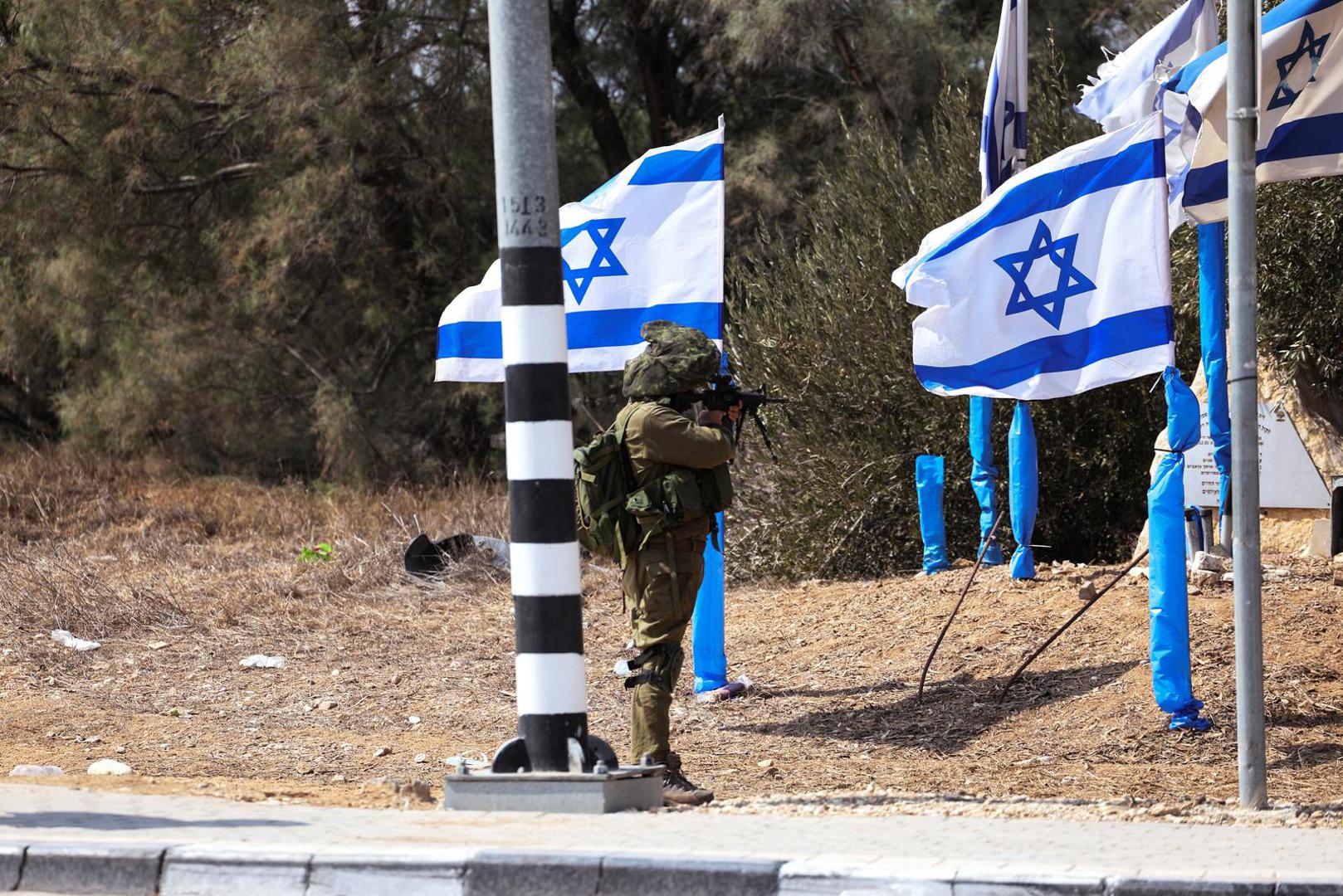 An Israeli soldier stands in position at the entrance to Kibbutz Kfar Aza, in southern Israel, October 10, 2023. REUTERS/Ronen Zvulun Photo: RONEN ZVULUN/REUTERS