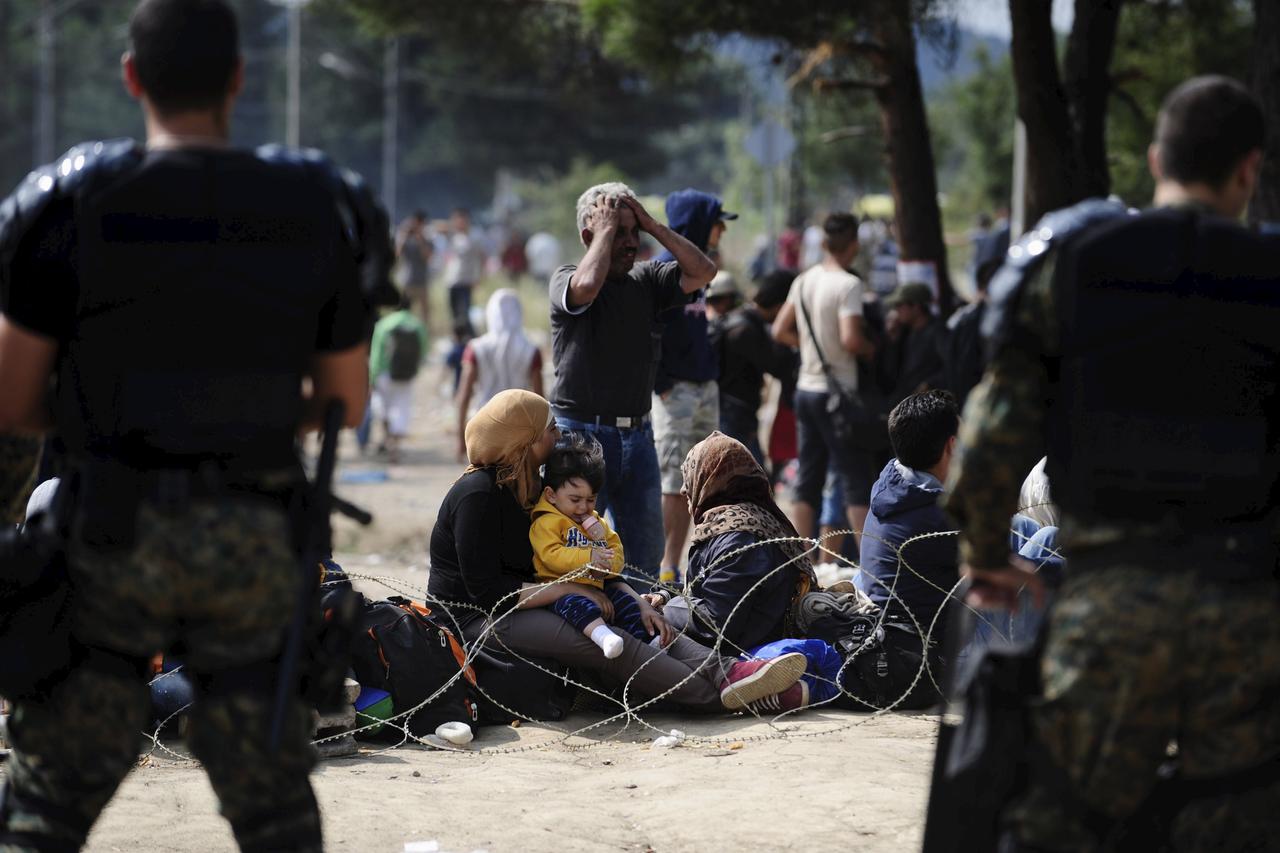 Macedonian special policemen guard the border as more than a thousand immigrants wait at the border line of Macedonia and Greece to enter Macedonia near the Gevgelija railway station August 21, 2015. Macedonian police drove back crowds of migrants and ref