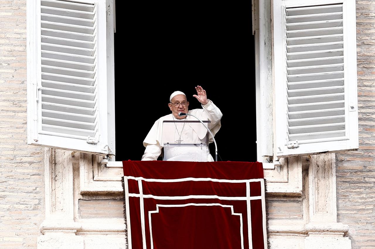 Pope Francis leads the Angelus prayer from his window at the Vatican