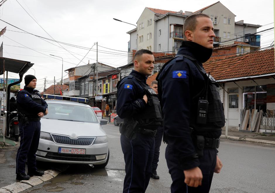 Kosovo police officers patrol in ethnically mixed area in North Mitrovica