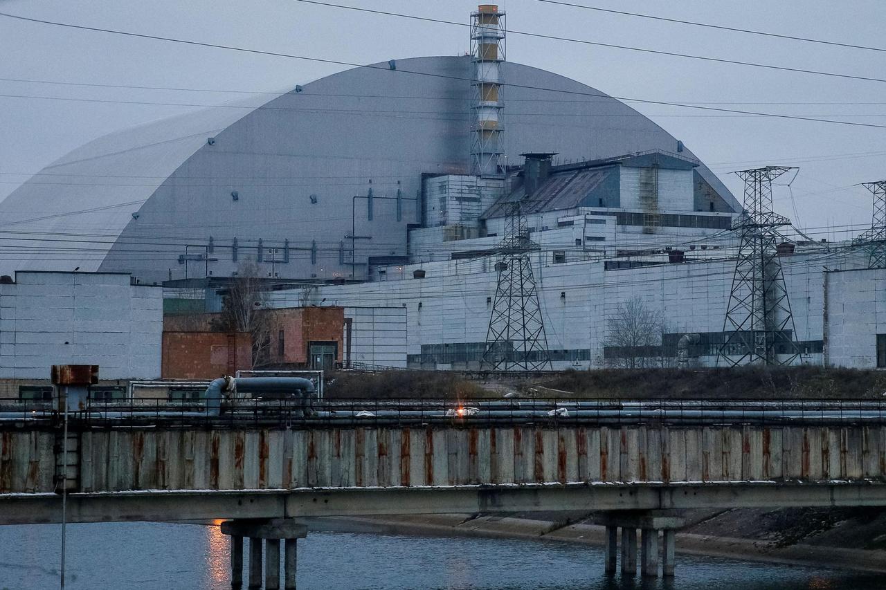 FILE PHOTO: A general view shows the New Safe Confinement structure over the old sarcophagus covering the damaged fourth reactor at the Chernobyl Nuclear Power Plant, in Chernobyl