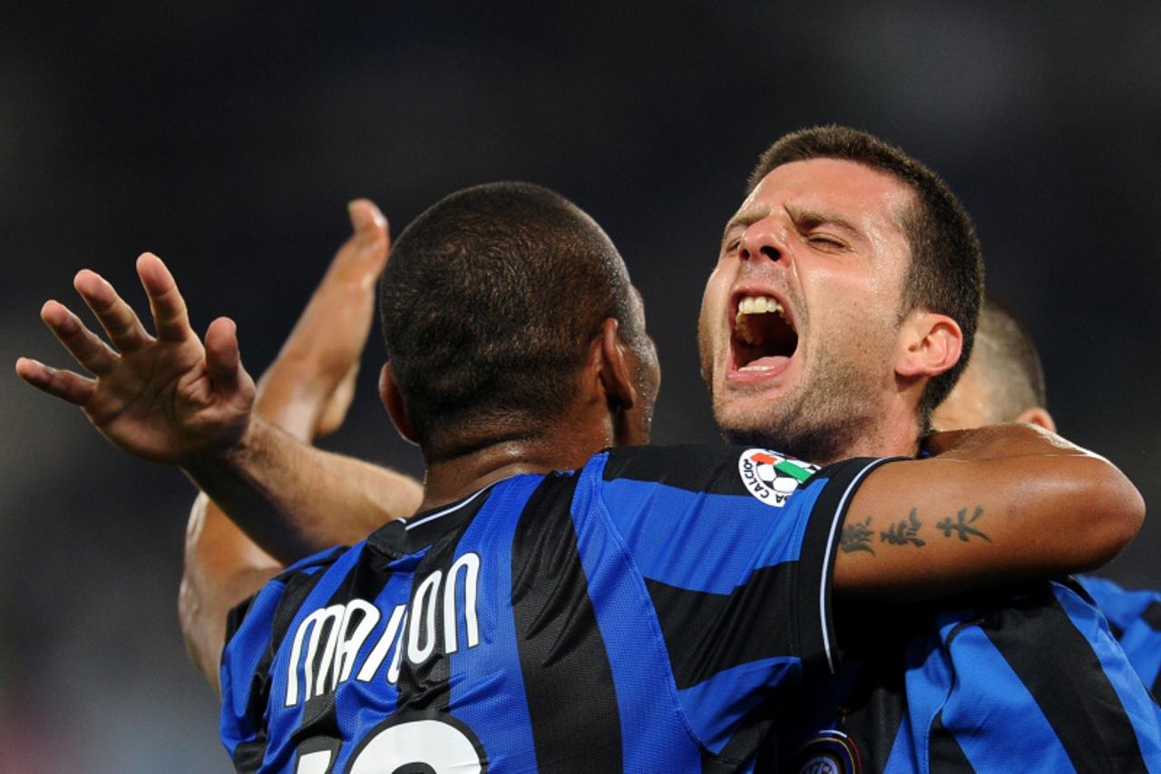 'Inter Milan\'s Brazilian midfielder Thiago Motta (R) celebrates with teammate after scoring during the Italian serie A football match Lazio vs Inter Milan, at Olympic stadium in Rome on May 2, 2010. 