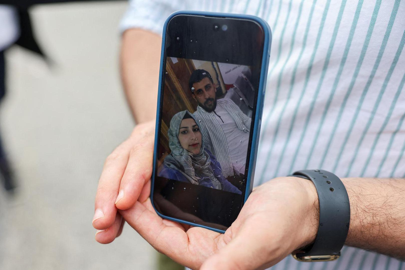 Syrian Kassam Abozeed, 34, who says his wife Israa and brother-in-law were onboard a boat with migrants that capsized at open sea off Greece, demonstrates a photo of him and his wife, at the port of Kalamata, Greece, June 15, 2023. REUTERS/Stelios Misinas Photo: STELIOS MISINAS/REUTERS