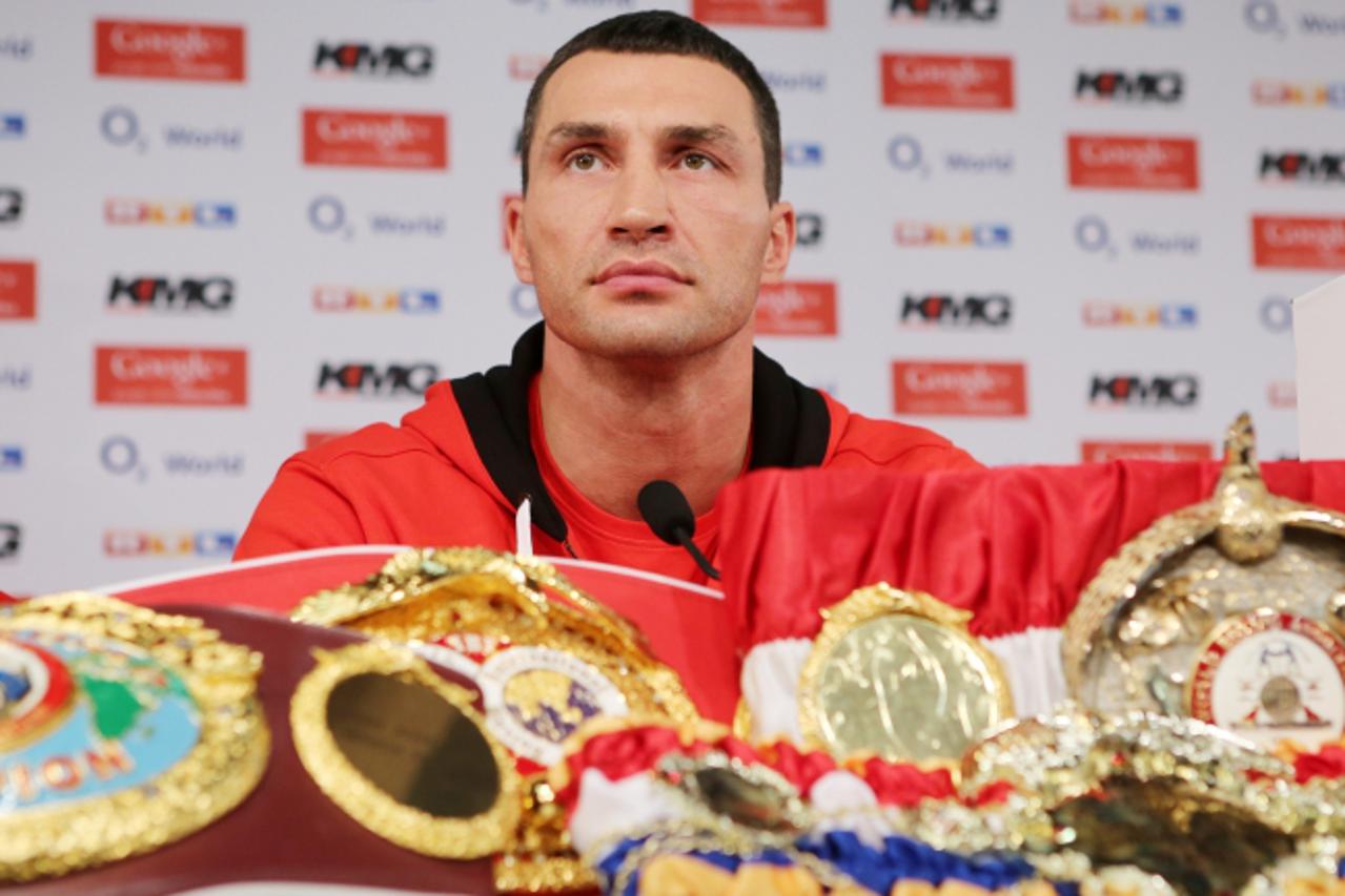 'Ukrainian box champion Wladimir Klitschko addresses a press conference on November 5, 2012 in Hamburg, northern Germany. Klitschko prepares to defend his WBA, WBO and IBF belts on November 10, 2012 i