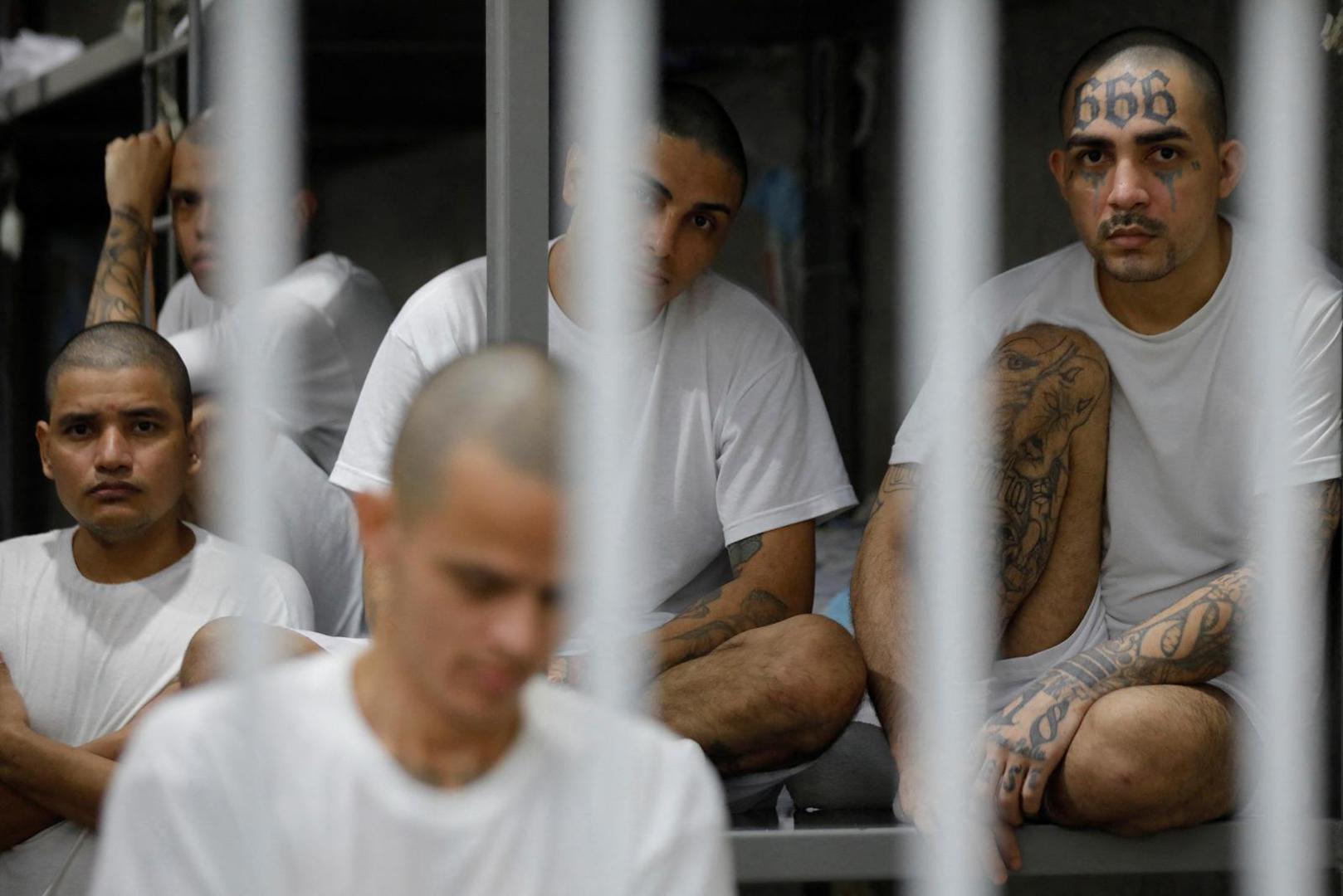 Inmates remain in their cell, during a tour in the "Terrorism Confinement Center" (CECOT) complex, which according to El Salvador's President, Nayib Bukele, is designed to hold 40,000 inmates, in Tecoluca, El Salvador October 12, 2023. REUTERS/Jose Cabezas Photo: Jose CABEZAS/REUTERS