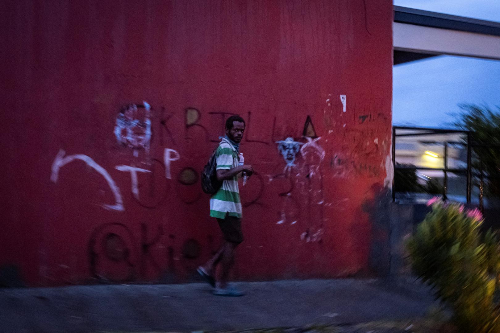 A man walks in the rain as Hurricane Beryl hits the southern coast of the island, in Kingston, Jamaica, July 3, 2024. REUTERS/Marco Bello Photo: MARCO BELLO/REUTERS