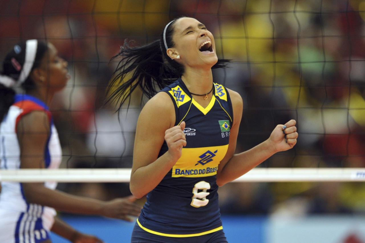 'Brazil\'s Jaqueline Carvalho celebrates after defeating Cuba in their second round match of the FIVB Women\'s Volleyball World Championship in Nagoya, central Japan November 7, 2010.   REUTERS/FIVB/H
