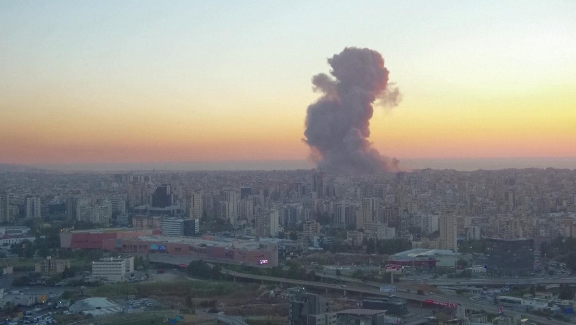 A screen grab shows smoke rising behind buildings in Beirut, Lebanon September 27, 2024. REUTERS TV/via REUTERS Photo: REUTERS TV/REUTERS