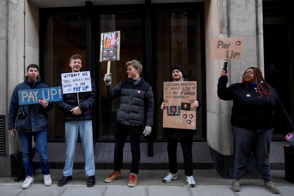 Teachers join the strike action at a picket line in London