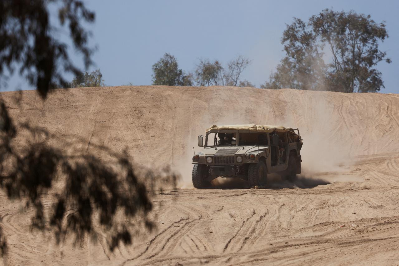 An Israeli military jeep manoeuvres near the Israel-Gaza border, amid the ongoing conflict between Israel and the Palestinian Islamist group Hamas