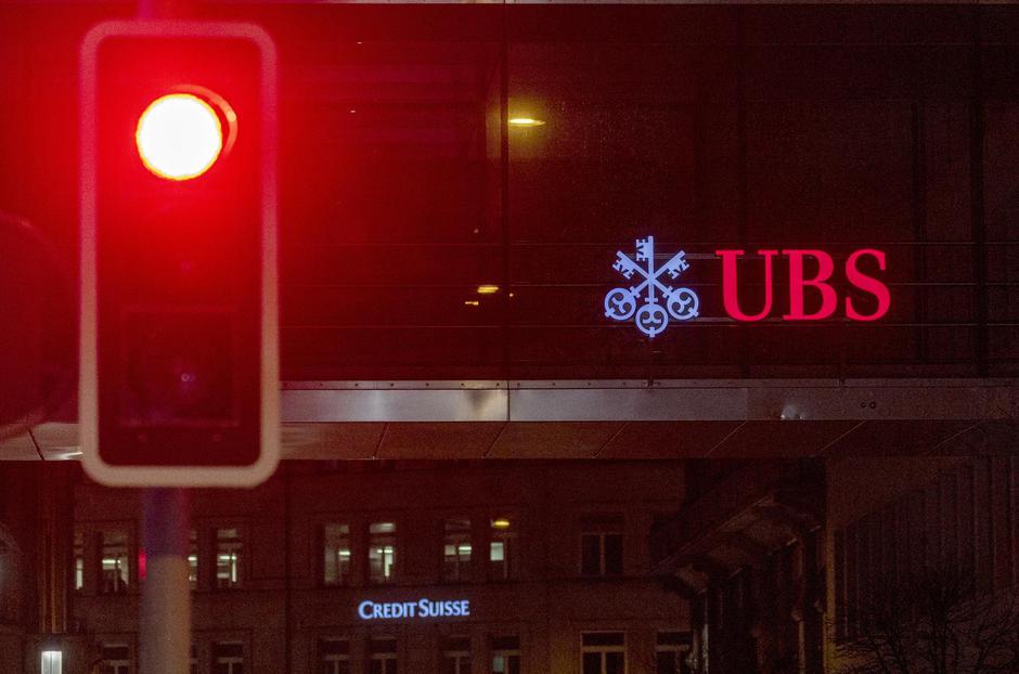 UBS and Credit Suisse banks logos are seen in Zurich