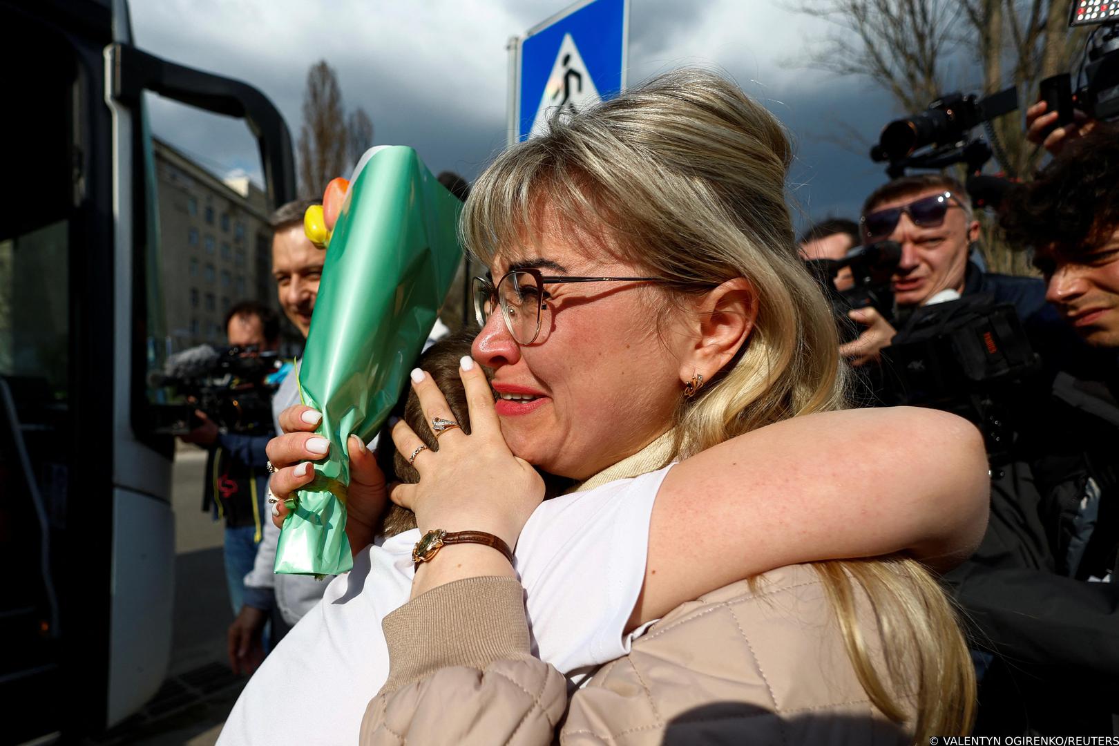 Yana Shapochko reacts as she embraces her 9-year-old nephew Danyil, who was taken by his grandmother from the non-government-controlled territory of Kharkiv region to Russia due to security reasons, after he returned via the Ukraine-Belarus border, in Kyiv, Ukraine April 8, 2023. REUTERS/Valentyn Ogirenko Photo: VALENTYN OGIRENKO/REUTERS