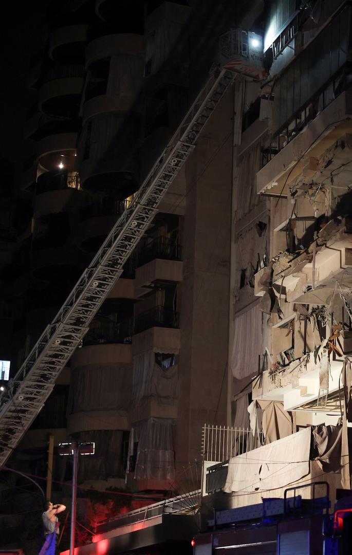 A person stands next to a damaged building at the site of an Israeli air strike, amid ongoing hostilities between Hezbollah and Israeli forces, in Ras Al- Nabaa, in Beirut, Lebanon, October 10, 2024. REUTERS/Louisa Gouliamaki Photo: LOUISA GOULIAMAKI/REUTERS