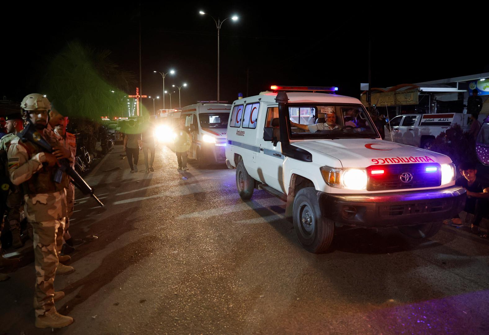 Security forces keep watch next to ambulances near a hospital following a fatal fire at a wedding celebration, in Iraq's Nineveh province, Iraq, September 27, 2023. REUTERS/Khalid Al-Mousily Photo: KHALID AL-MOUSILY/REUTERS