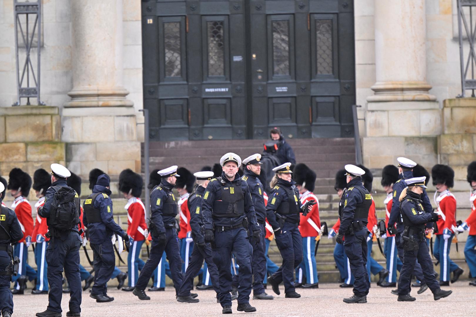 Police officers and members of the Royal Life Guards walk at the Christiansborg Palace Square, on the day Denmark's Queen Margrethe abdicates after a reign of 52 years and her elder son, Crown Prince Frederik, ascends the throne as King Frederik X in Copenhagen, Denmark, January 14, 2024. Ritzau Scanpix/Nils Meilvang via REUTERS    ATTENTION EDITORS - THIS IMAGE WAS PROVIDED BY A THIRD PARTY. DENMARK OUT. NO COMMERCIAL OR EDITORIAL SALES IN DENMARK. Photo: Ritzau Scanpix Denmark/REUTERS