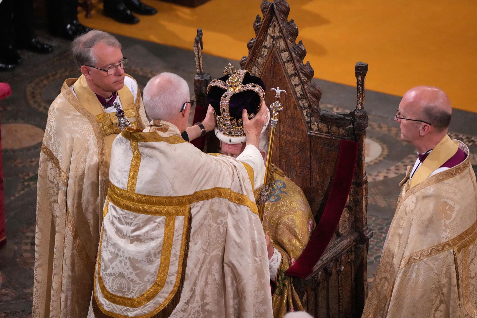 King Charles III is crowned with St Edward's Crown by The Archbishop of Canterbury the Most Reverend Justin Welby during his coronation ceremony in Westminster Abbey, London. Picture date: Saturday May 6, 2023. Photo: Aaron Chown/PRESS ASSOCIATION