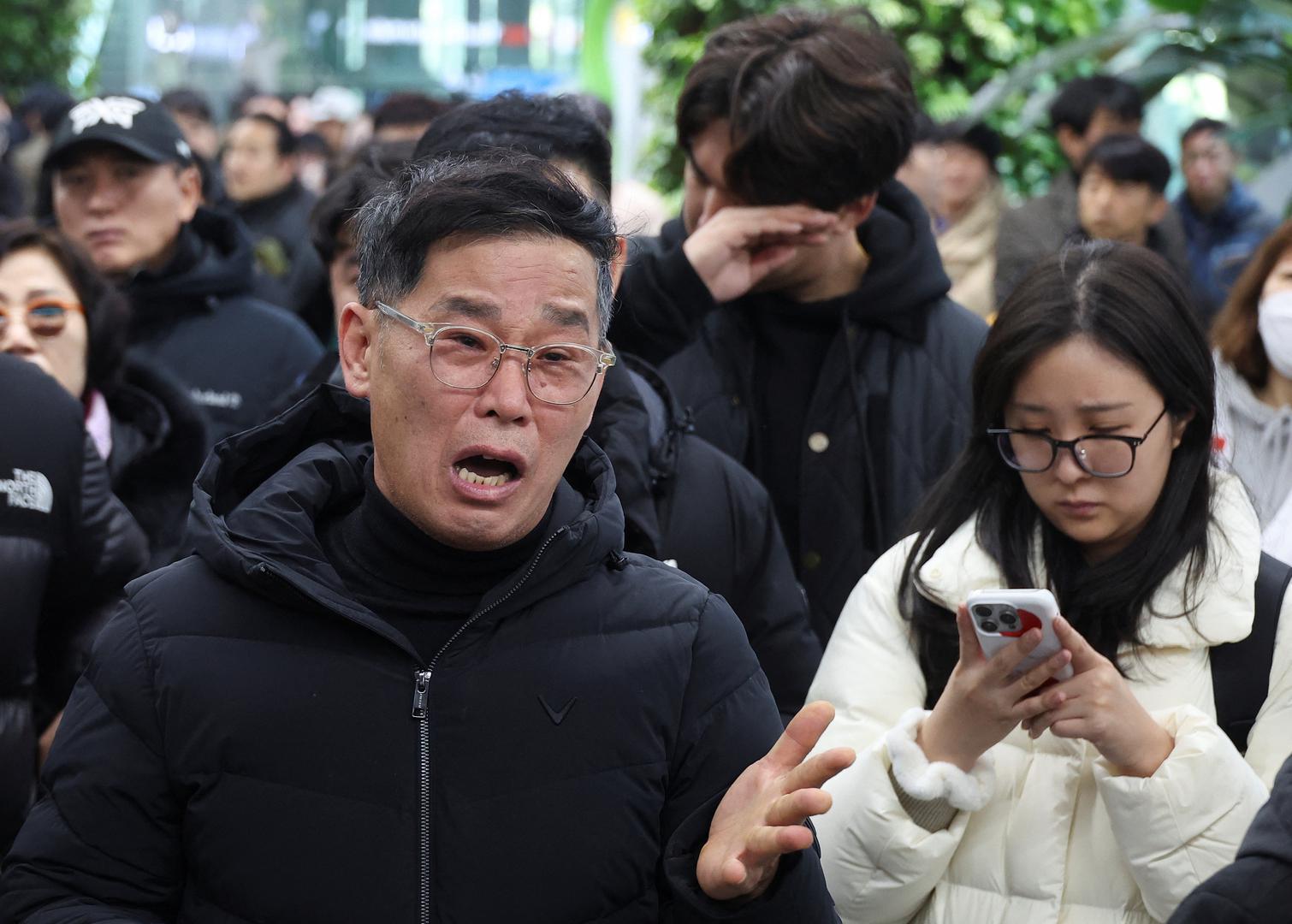 A relative of a passenger of the aircraft that crashed after it went off the runway, reacts at Muan International Airport, in Muan, South Korea, December 29, 2024. REUTERS/Kim Hong-Ji Photo: KIM HONG-JI/REUTERS