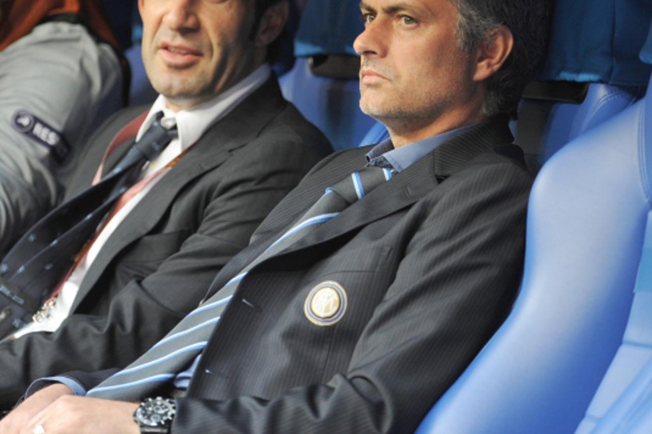 'Inter\'s head coach Jose Mourinho (R) and former Inter player Luis Figo pictured prior to the UEFA Champions League final FC Bayern Munich vs FC Internazionale Milano at Santiago Bernabeu stadium in 