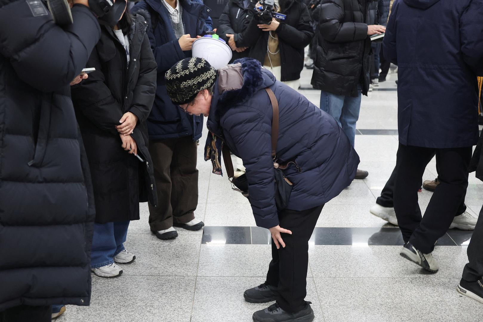 A relative of a passenger of the aircraft that crashed after it went off the runway, reacts at Muan International Airport, in Muan, South Korea, December 29, 2024. REUTERS/Kim Hong-Ji Photo: KIM HONG-JI/REUTERS