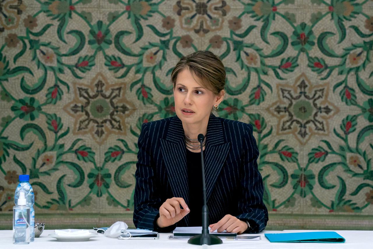 FILE PHOTO: Asma al-Assad, wife of Syrian President Bashar al-Assad, meets with humanitarian and business groups in Damascus