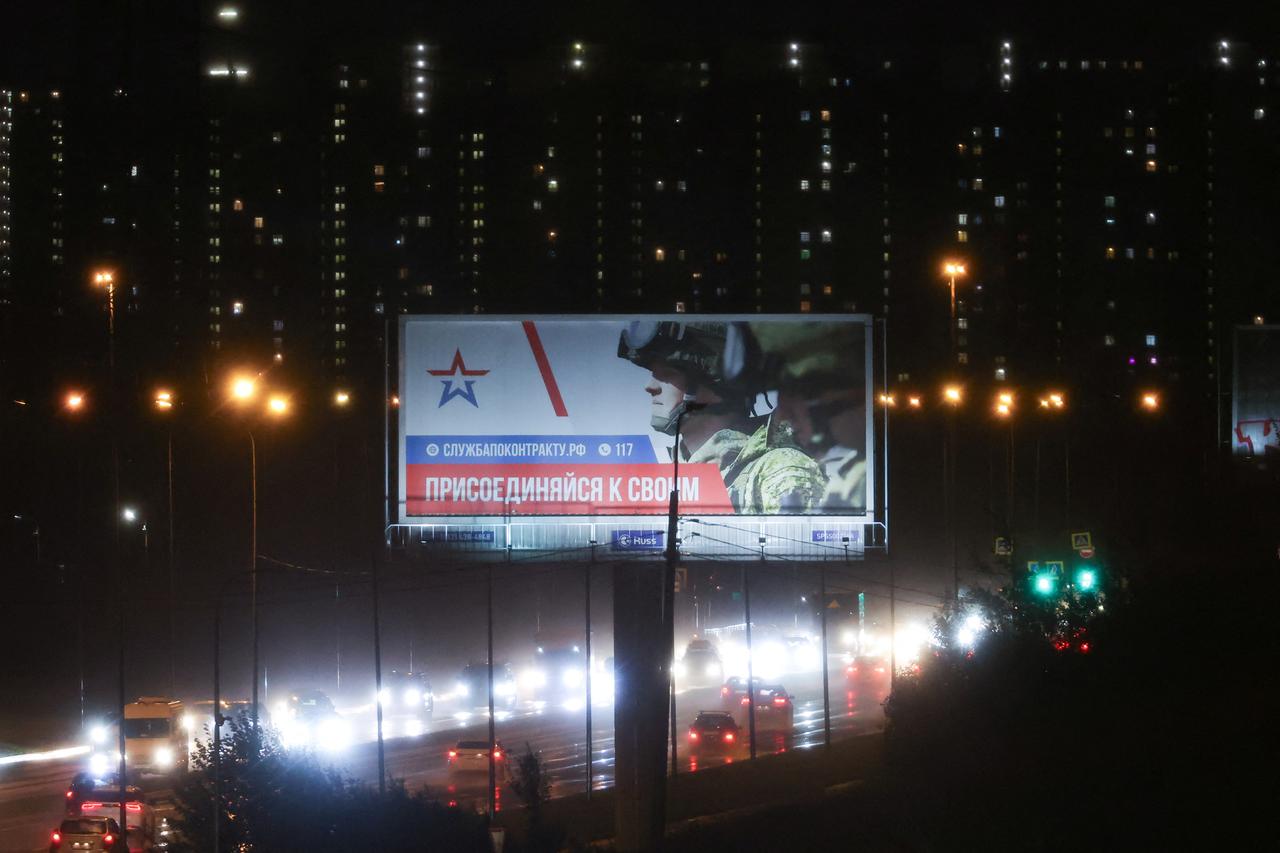 An advertising board promoting military service under contract with Russian Armed Forces, in Saint Petersburg