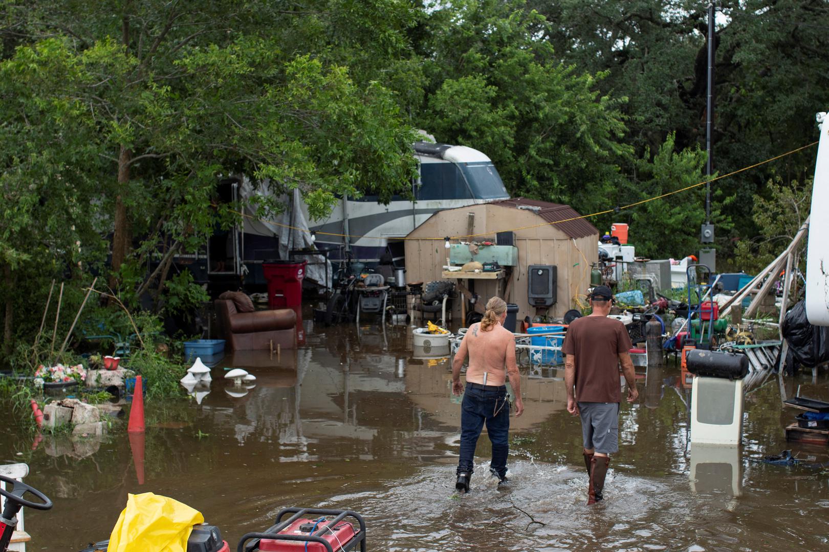 Archie Herbert and Guy Snyder walk outside of their flooded homes after Hurricane Beryl moved through the area in Bay City, Texas, U.S. July 8, 2024.  REUTERS/Kaylee Greenlee Beal Photo: KAYLEE GREENLEE BEAL/REUTERS