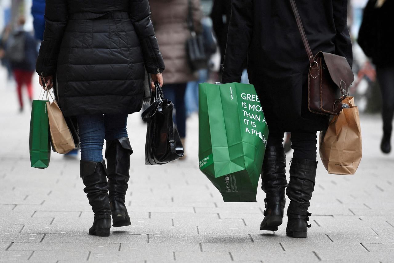 FILE PHOTO: People carry their shopping bags in downtown Hamburg