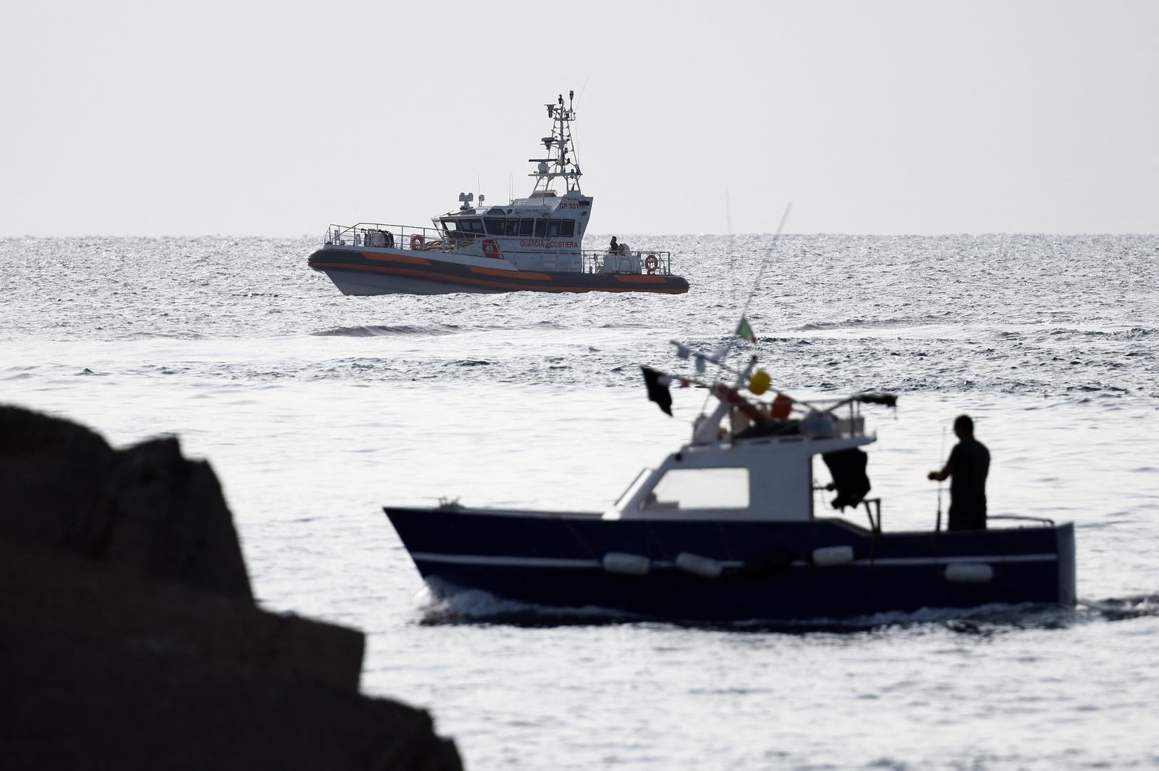 A fishing boat sails past a coast guard vessel operating in the sea to search for the missing, including British entrepreneur Mike Lynch, after a luxury yacht sank off the coast of Porticello, near the Sicilian city of Palermo, Italy, August 20, 2024. REUTERS/Guglielmo Mangiapane Photo: GUGLIELMO MANGIAPANE/REUTERS