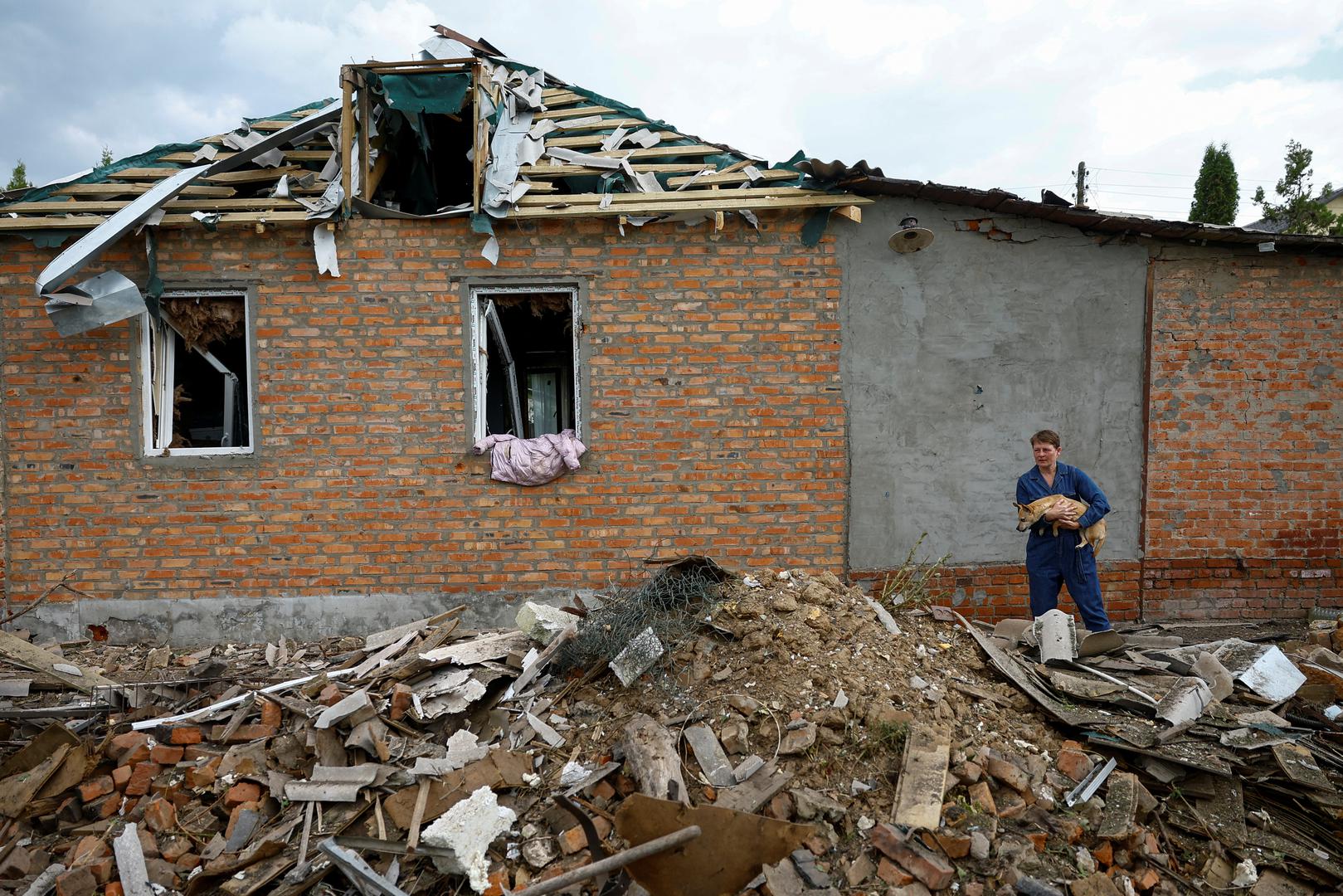 Local resident Yana looks at her house damaged by a Russian air strike, amid Russia's attack on Ukraine, in Kharkiv, Ukraine May 18, 2024. REUTERS/Valentyn Ogirenko Photo: VALENTYN OGIRENKO/REUTERS