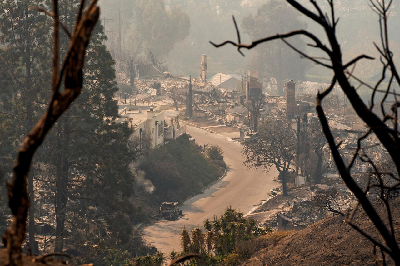 The remains of homes following the Palisades Fire in the Pacific Palisades neighborhood in Los Angeles