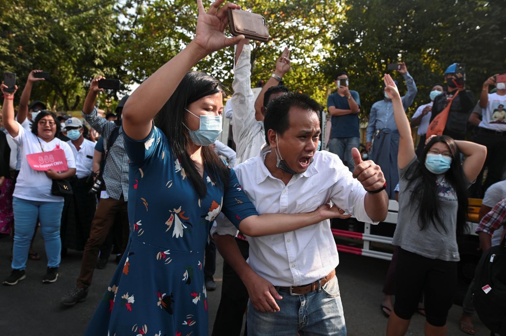 Protest against the military coup, in Yangon People react outside Myanmar's Central Bank during a protest against the military coup, in Yangon, Myanmar, February 15, 2021. REUTERS/Stringer STRINGER