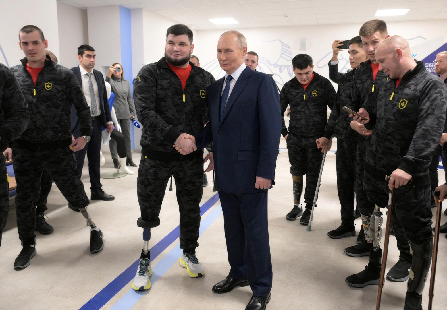 Russia's President Vladimir Putin meets with service members of the Russian armed forces, who were involved in the country's military campaign in Ukraine and currently undergo rehabilitation at the National medical research centre for traumatology and orthopedics, on International Day of Persons with Disabilities in Moscow, Russia, December 3, 2024. Sputnik/Vladimir Astapkovich/Pool via REUTERS ATTENTION EDITORS - THIS IMAGE WAS PROVIDED BY A THIRD PARTY.     TPX IMAGES OF THE DAY Photo: Vladimir Astapkovich/REUTERS