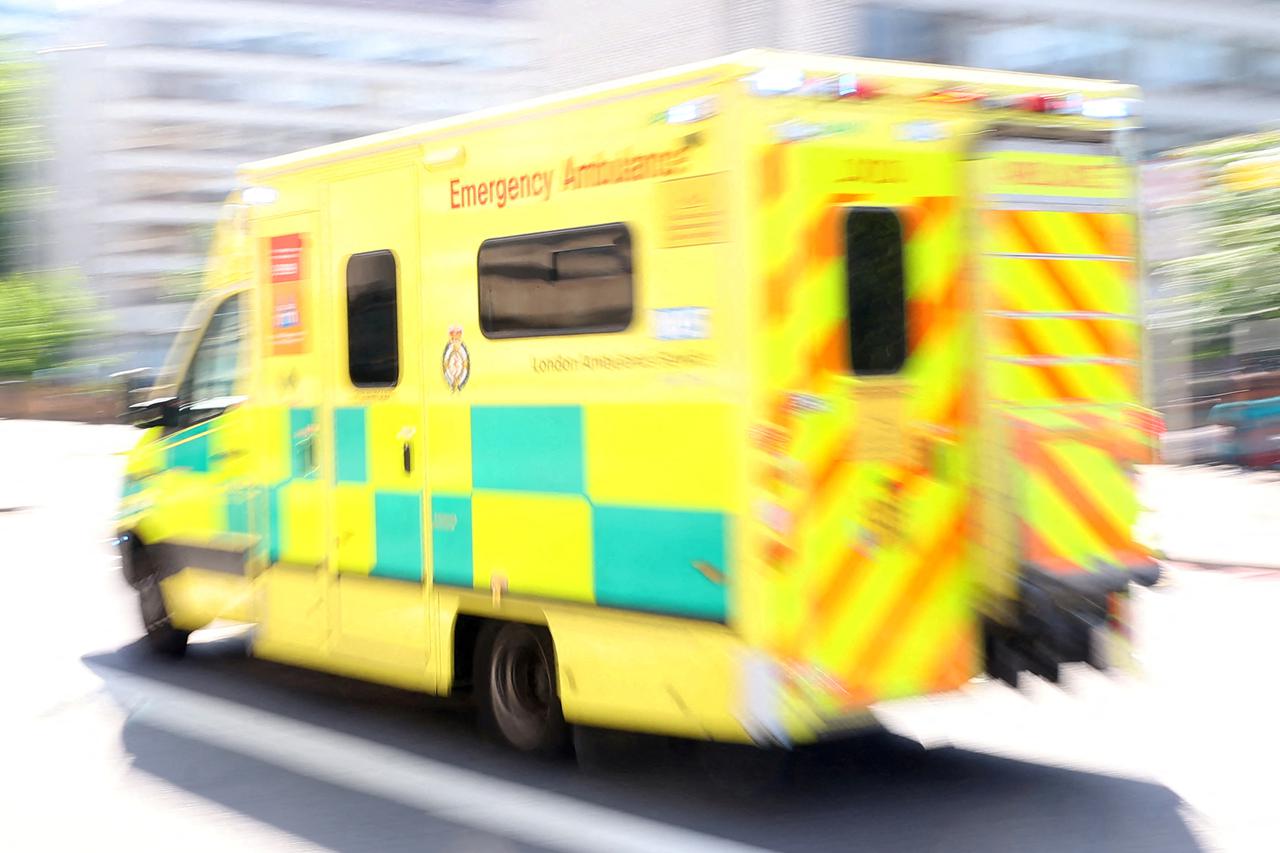 FILE PHOTO: An ambulance is driven in central London