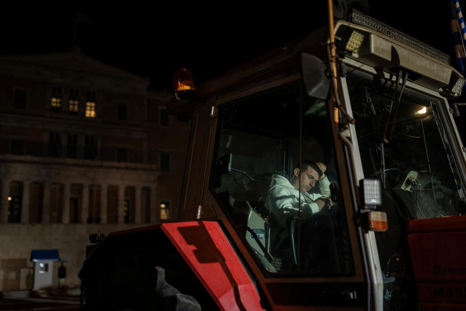 A Greek farmer on a tractor takes part in a protest over rising energy costs and competition from imports, in front of the parliament building in Athens, Greece, February 20, 2024. REUTERS/Alkis Konstantinidis Photo: Alkis Konstantinidis/REUTERS