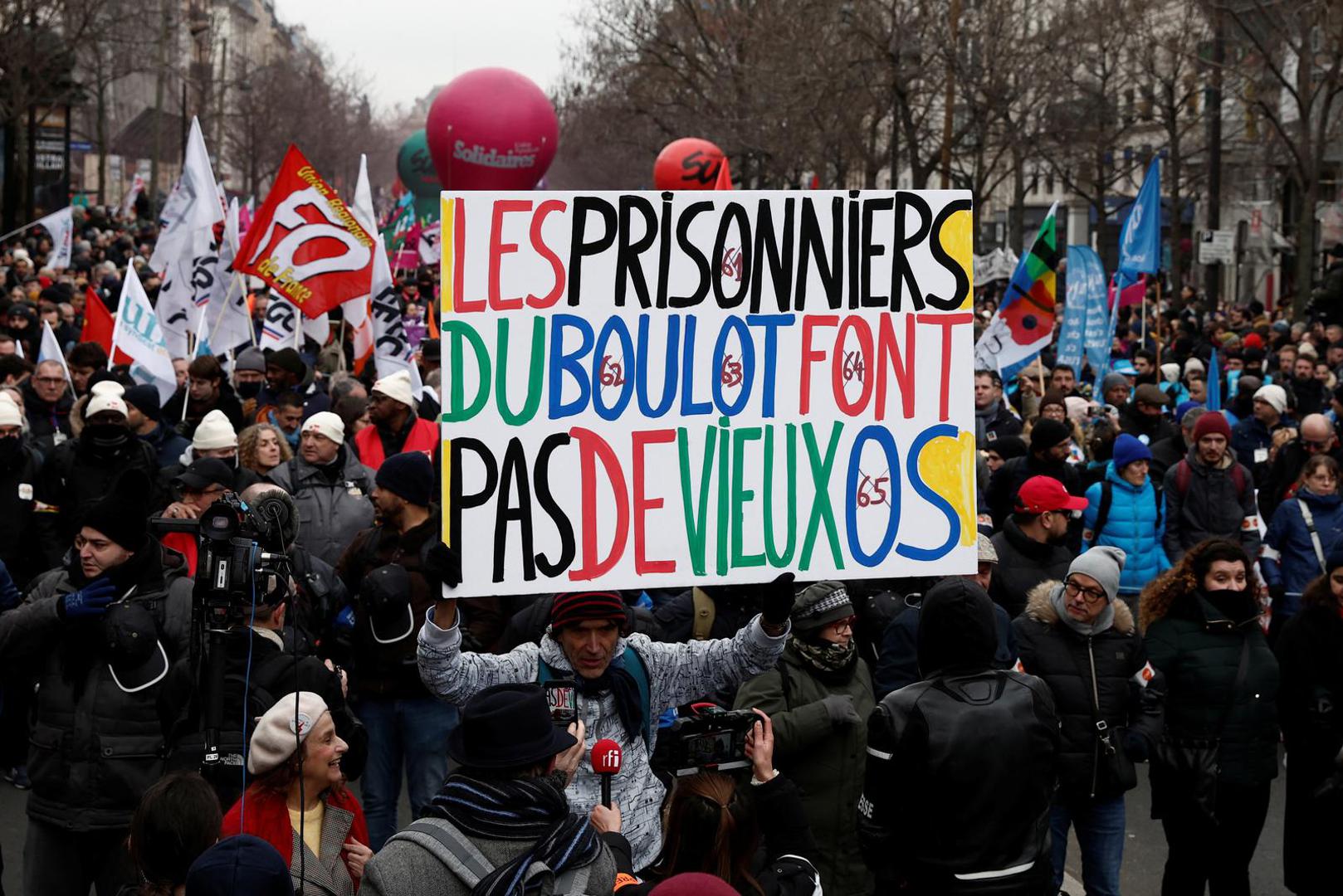 Protesters attend a demonstration against French government's pension reform plan in Paris as part of a day of national strike and protests in France, January 19, 2023. The slogan reads "Work prisoners do not last long". REUTERS/Benoit Tessier Photo: BENOIT TESSIER/REUTERS