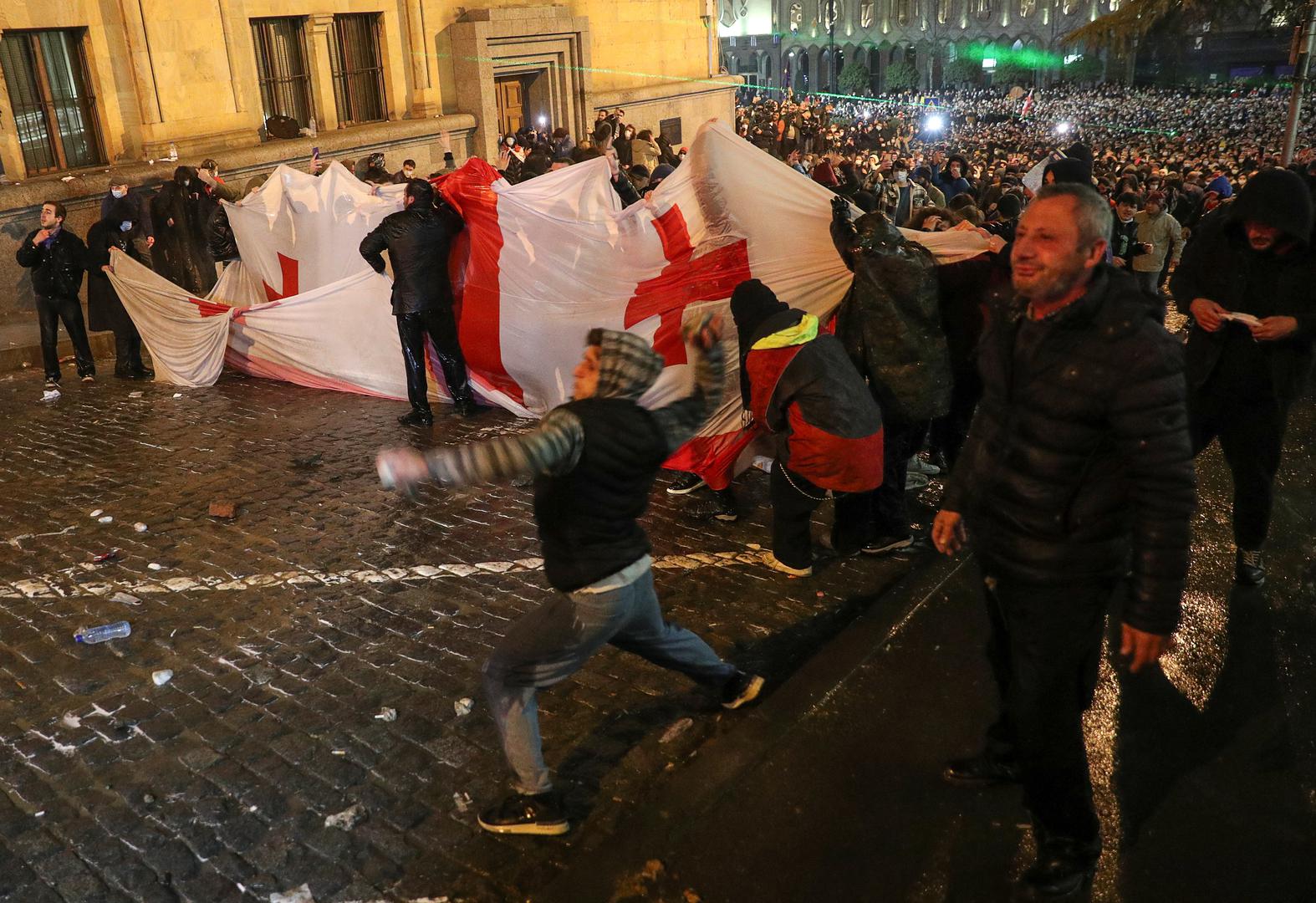 Protesters gather in front of police officers, who block the way during a rally against the "foreign agents" law in Tbilisi, Georgia, March 7, 2023. REUTERS/Irakli Gedenidze Photo: IRAKLI GEDENIDZE/REUTERS