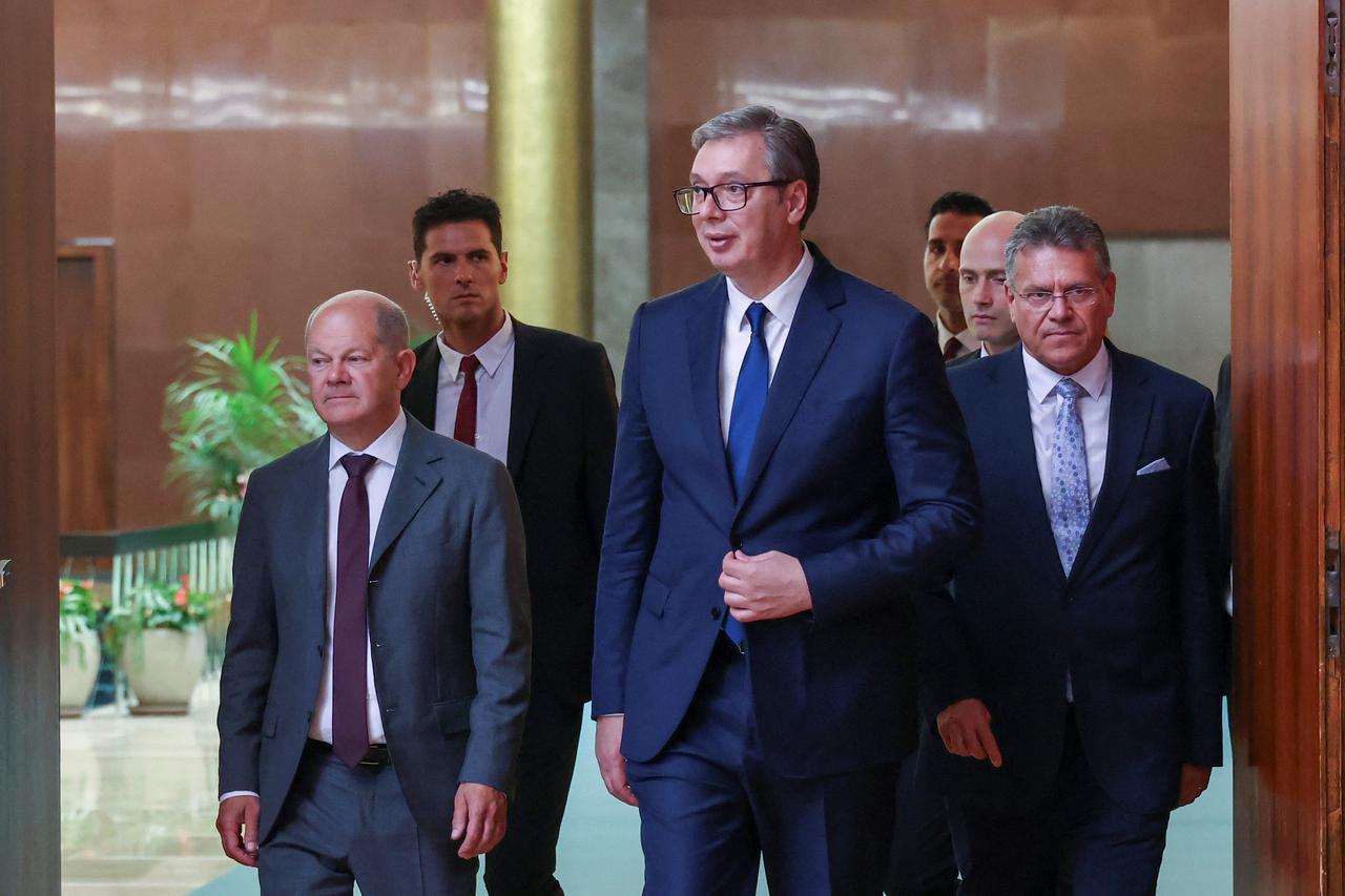 German Chancellor Olaf Scholz, Serbian President Aleksandar Vucic and European Commission Vice President Maros Sefcovic arrive to a press conference, during a critical raw materials summit in Belgrade