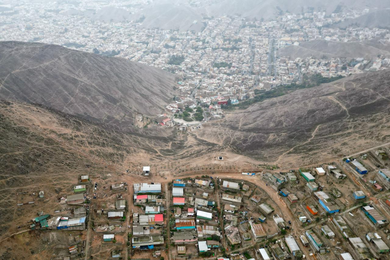 FILE PHOTO: Peru tears down "wall of shame" but wealth divide stays strong, in Lima