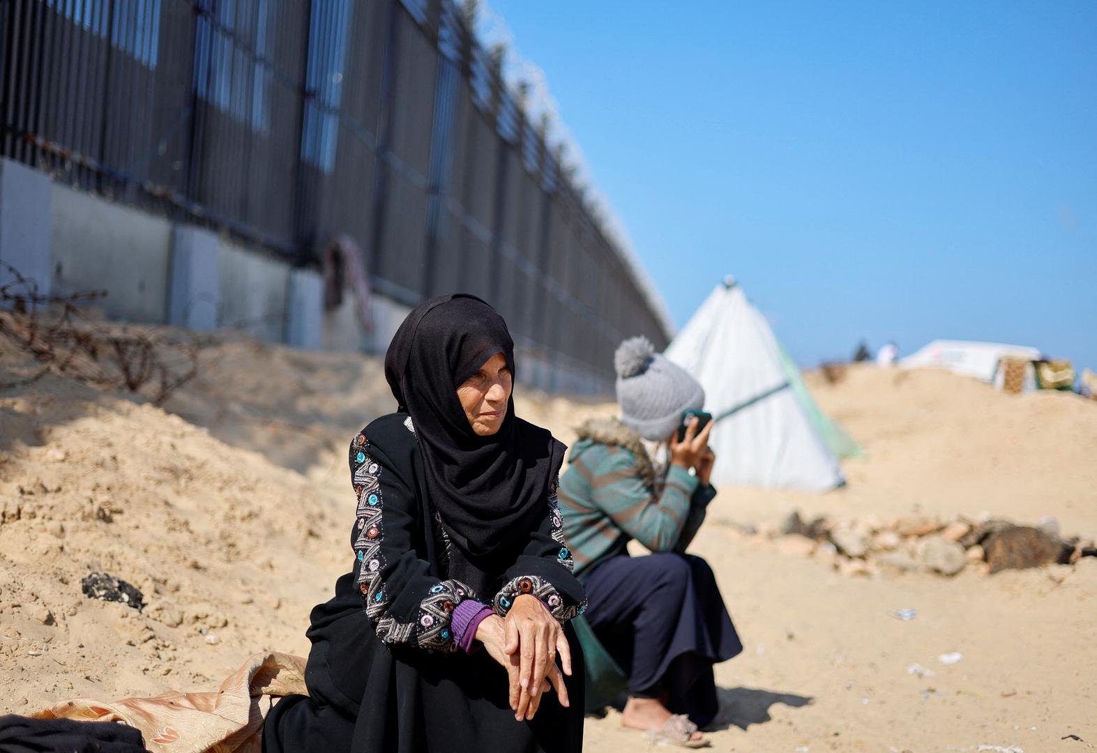 Displaced Palestinian woman Laila Abu Mustafa, who fled her house due to Israeli strikes, shelters at the border with Egypt, in Rafah in the southern Gaza Strip, February 10, 2024. REUTERS/Mohammed Salem Photo: MOHAMMED SALEM/REUTERS