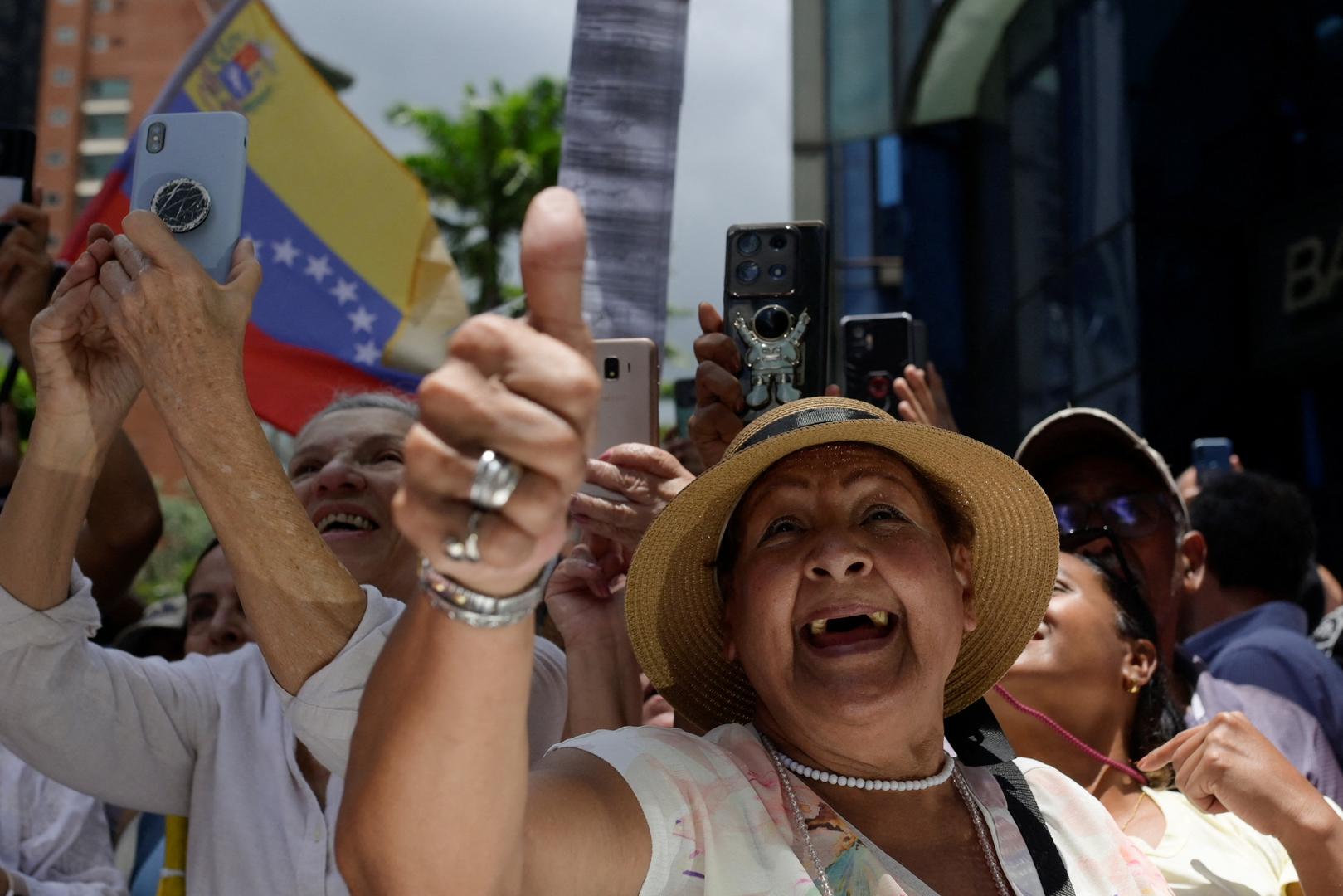 Supporters of Venezuelan opposition leader Maria Corina Machado react as she speaks during a protest against the election results announced by Venezuelan President Nicolas Maduro's government after he was declared winner of the election, in Caracas, Venezuela August 28, 2024. REUTERS/Maxwell Briceno Photo: Maxwell Briceno/REUTERS