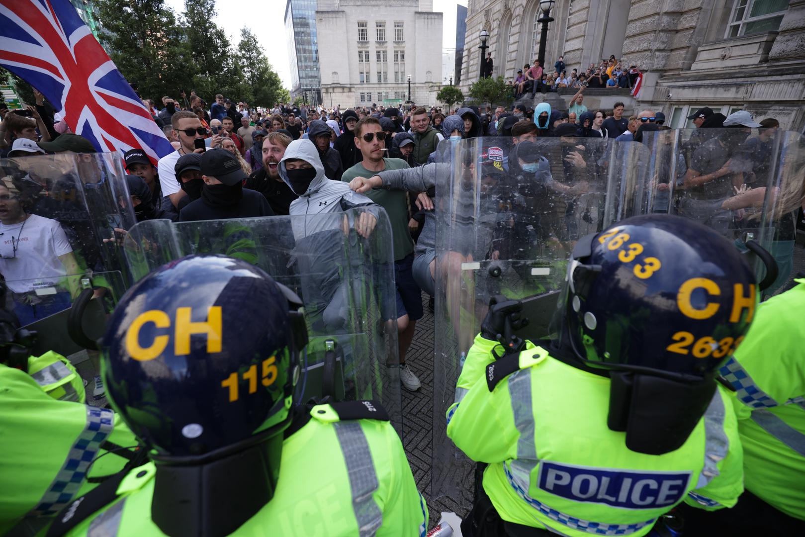 Police officers face protesters in Liverpool, following the stabbing attacks on Monday in Southport, in which three young children were killed. Picture date: Saturday August 3, 2024. Photo: James Speakman/PRESS ASSOCIATION