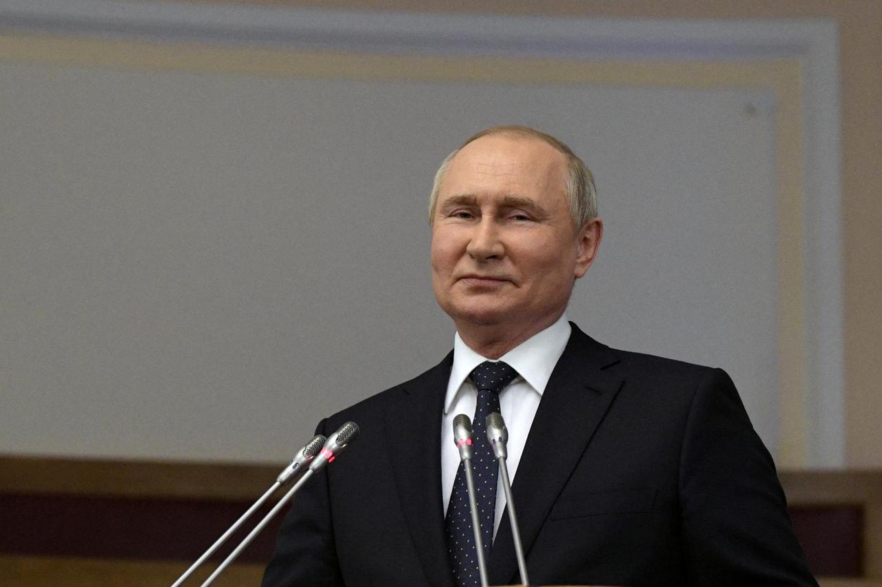 Russian President Vladimir Putin delivers a speech during a meeting of the Council of Legislators at the Federal Assembly in Saint Petersburg