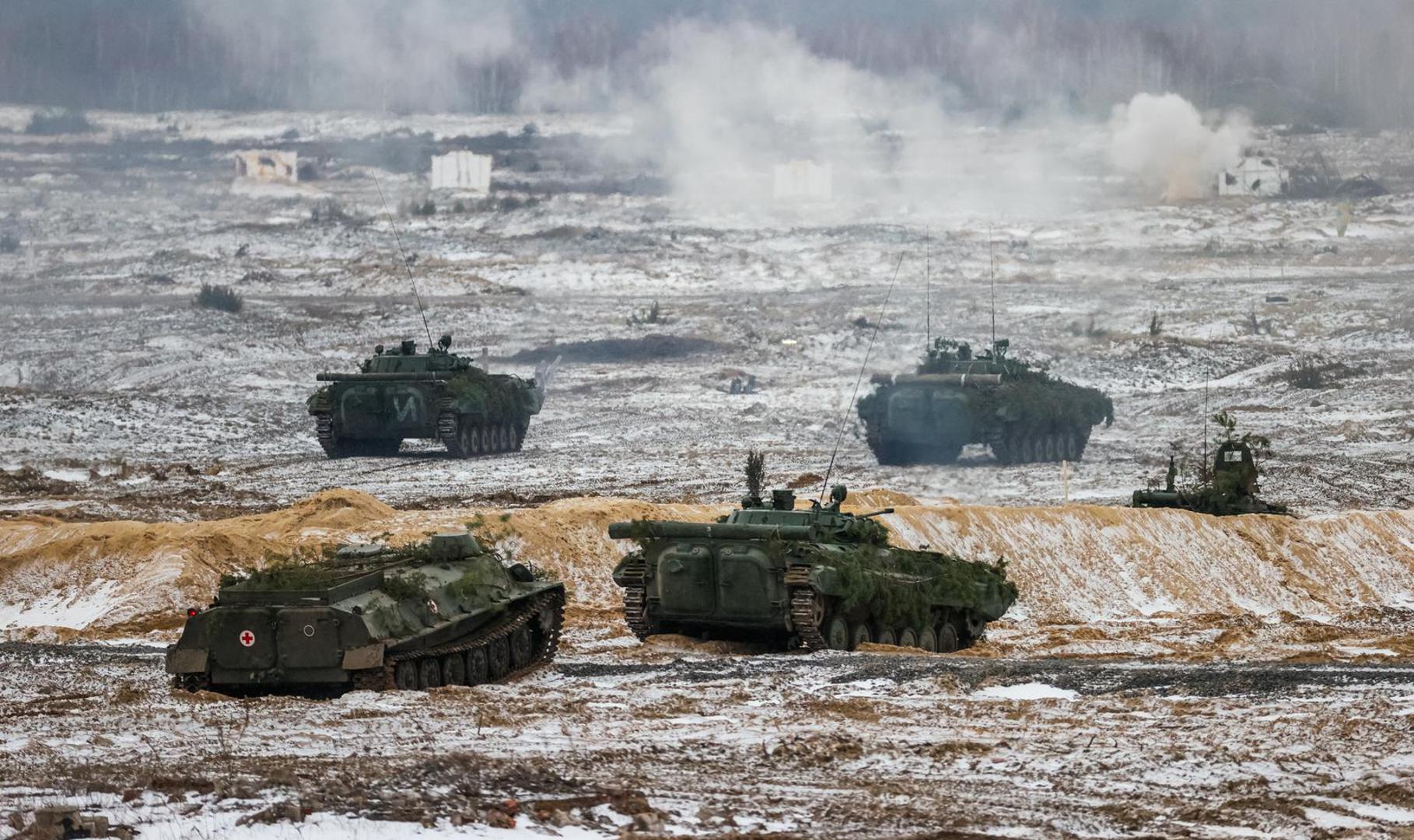 BREST REGION, BELARUS - FEBRUARY 3, 2022: An MT-LB multi-purpose fully amphibious armored tracked vehicle (L) and infantry fighting vehicles take part in an exercise to test response forces of the Union State of Russia and Belarus at Brestsky firing range. Combined arms, paratrooper, artillery and air force units have completed field firing. Gavriil Grigorov/TASS Photo via Newscom Photo: Gavriil Grigorov/NEWSCOM