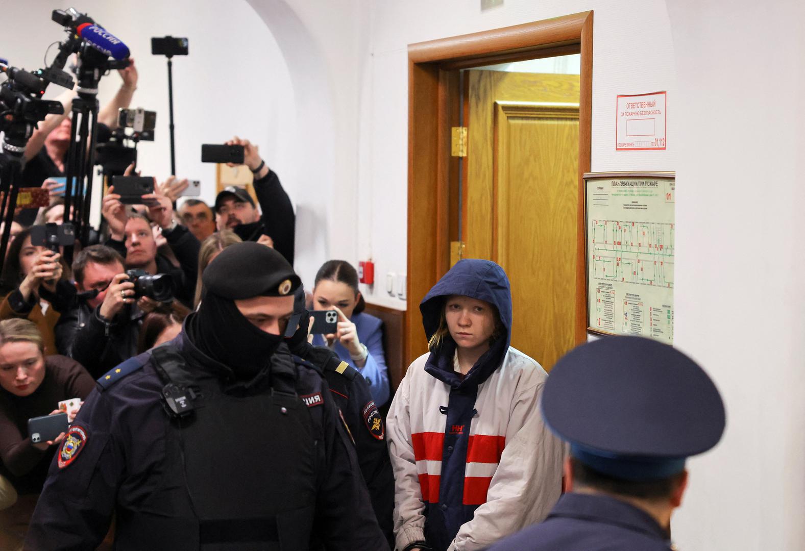 Darya Trepova, who is suspected of the killing of Russian military blogger Maxim Fomin widely known by the name of Vladlen Tatarsky, is escorted inside a court building before a hearing in Moscow, Russia, April 4, 2023. REUTERS/Evgenia Novozhenina Photo: EVGENIA NOVOZHENINA/REUTERS