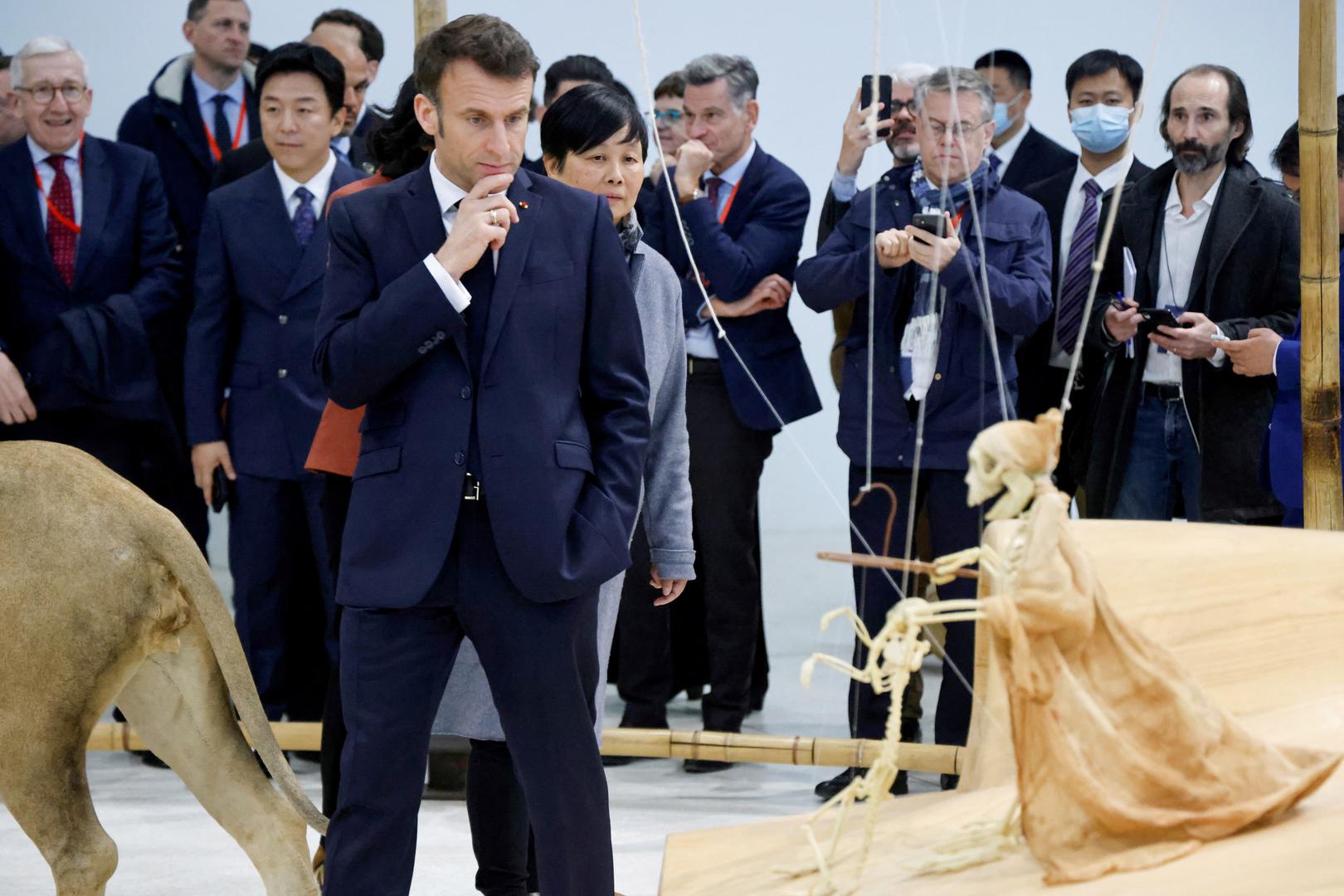 French president Emmanuel Macron visits the expo of the Red Brick Art Museum with French culture minister Rima Abdul Malak and Chinese artists in Beijing, China April 5, 2023. Ludovic Marin/Pool via REUTERS Photo: POOL/REUTERS